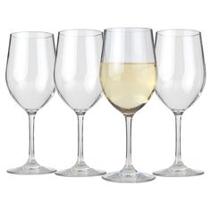 four wine glasses are lined up next to each other