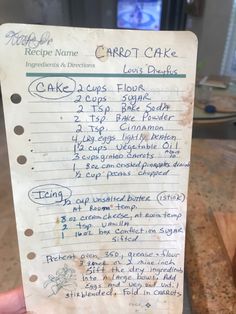 the recipe for carrot cake is written on a piece of paper with blue marker writing