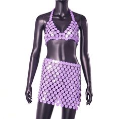 This two-piece metallic disco set includes a halter crop top and mini skirt in a vibrant lavender shade. Perfect for dancing the night away, this set is both stylish and comfortable. Elevate your party look with this must-have ensemble. Fabric: Non-Stretch Material: Acrylic Purple Summer Crop Top For Parties, Purple Sequined Sets For Party, Purple Sequined Party Sets, Purple Sequin Party Sets, Purple Stretch Party Sets, Spring Party Purple Halter Top, Spring Purple Party Crop Top, Purple Halter Top For Summer Nights, Summer Purple Halter Top For Night Out