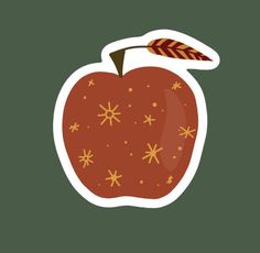 an apple sticker with snowflakes on the side and a leaf sticking out of it