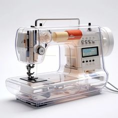 an electronic sewing machine sitting on top of a plastic case with buttons and needle attachments