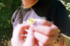 a young man holding something in his hand