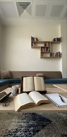 an open book sitting on top of a wooden table