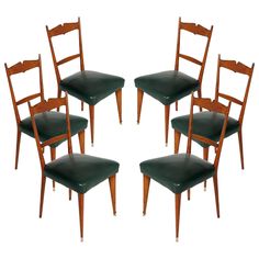 six wooden chairs with green leather seats on each one side and four in the middle