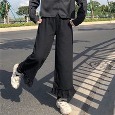 Brand Name: RomildiPant Style: Wide Leg PantsMaterial: COTTONMaterial: PolyesterFit Type: LOOSELength: Full LengthDecoration: PATTERNOrigin: CN(Origin)Season: Spring/AutumnWaist Type: HIGHModel Number: Kawaii Ruffled High Waist Solid PantsPattern Type: SolidStyle: SweetFront Style: FlatAge: Ages 18-35 Years OldFabric Type: CanvasClosure Type: Elastic WaistGender: WOMENStyle: Fashion,Casual, Loose,Streetwear,Basic.KawaiiSuitable crowd: 18-35 year woman Japanese Kawaii, Loose Trousers, Women Pants, Soft Girl, Black Pants, Harem Pants, Casual Fashion, Elastic Waist, High Waist