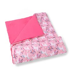 a pink blanket with unicorns on it and a pink square pillow next to it