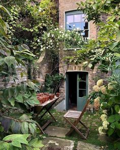 an outdoor area with potted plants and a table