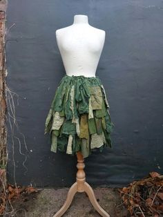 Upcycled Skirt Woman's Clothing   Shades of green, a lot of ruffles made of shredded hand dyed lace, cotton, linen and jersey.  Raw edges are part of the hippie design:)  Messy and romantic:)   Ready to ship. Stripe will help you to fit the skirt according to your size.       Size Small/Medium /Large/XLarge Measurements: waist/hips up to 49inch(125cm) length 23(58cm) Are you looking for a different size or colours?                                                                                   I will be more than happy to design something just for you. :) Tattered Skirt, Faire Outfit, Upcycled Skirt, Fairy Gown, Forest Clothes, Pixie Skirt, Dragons Clothes, Hippie Designs, Fairy Skirt