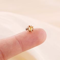 Metal: 14K solid gold, Not Plated or Gold Filled Available Gold color: Yellow gold  Stone: Citrine, Yellow Hair Quartz  Thickness: 0.82mm (20G) , 1.0mm (18G), 1.2mm (16G) Stamp: 14K on top or 14K gold back, no stamp on titanium back, ★Sold as single piece ★Threadless Push Pin (Flat Back) ★ We have two different materials of Push back for you choose: ● One is 14K solid gold with length : 6mm(standard), 8mm, 10mm (long)  ● Another is implanted grade titanium push back in size 5mm(short) 6mm 8mm an Dainty Gold Piercings With Birthstone, Elegant Gold Piercings With Birthstone, Elegant Gold Birthstone Piercings, Dainty Gold Cartilage Earrings With Birthstone, Gold Elegant Cartilage Earrings With Birthstone, Elegant Gold Cartilage Earrings With Birthstone, Single Gold Flower Earring, Delicate Yellow Gold Piercings For Gift, Gold Flower Single Earring Jewelry