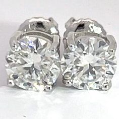 * Size - 6.5mm * Precious Metal - 925 Silver  * Gemstone - Moissanite  * Carat Weight - 1 carat Each Ear, Total Carat Weight 2 Carats  * VVS1 Quality Moissanite stud earrings round brilliant  cut 1 carat each ear for men and women . * Setting Type - 4 prong hand set  * Closure type - Screw backs  * If your looking for a pair of earrings that are very sharp and crispy with a tremendous amount of shine well then your in the right place . These beautiful brilliant cut moissanite gems were set in ge Diamond Tester, Earrings Round, Moissanite Earrings, Earrings Studs, Type 4, Precious Metal, 2 Carat, Round Earrings, 1 Carat