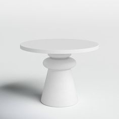 a white table sitting on top of a white floor