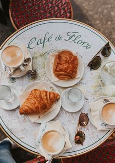 an overhead view of coffee and croissants on a table with the words cafe de honne