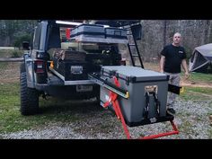 a man standing next to a truck with a tool box on it