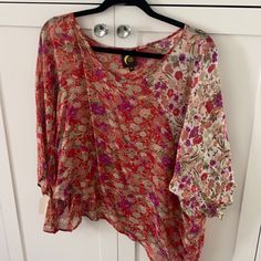 Blu Moon Flowe Top, Zoom In For Detail. Bought At A Sample Sale, Never Worn. Xs But Flowe & Roomy. Shorter In The Front, Longer In The Back. One Tiny Flaw In The Front V Neck Area But I Put A Photo & You Really Cannot See It. It Is A Flowe Drapery Top. Zoom In For Additional Details Of Pattern And Colors. Very Cute. Purple Floral Print Summer Top, Summer Floral Print Purple Tops, Summer Purple Floral Print Top, Summer Floral Print Purple Blouse, Summer Purple Floral Print Blouse, Purple Flowy Beach Top, Flowy Purple Beach Top, Pink Floral Print Festival Blouse, Summer Festival Blouse With Floral Print