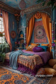 a bedroom decorated in blue, orange and pink with an elaborate canopy bed surrounded by pillows