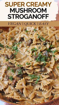 a bowl filled with mushroom stroganoni and parsley on top of a table