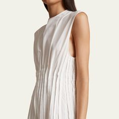 Khaite "Wes" georgette dress with waist pintuck pleats Jewel neckline Cap sleeves Full length A-line silhouette Button closure Silk Dry clean Made in Italy