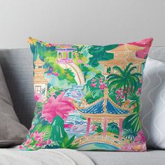 a colorful pillow sitting on top of a couch