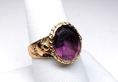 Etruscan Revival Amethyst Glass Solitaire Signet Ring in 14k Gold, Size 9, c. 1800s, 4.80g by EstateOfDecadence on Etsy Antique 14k Gold Amethyst Ring, Victorian Oval Jewelry With Historical Design, Gold Victorian Amethyst Ring In 14k Gold, Victorian Gold Amethyst Ring In 14k Gold, Antique 14k Stamped Amethyst Ring, Antique Amethyst Gemstone Ring For Formal Occasions, Victorian Amethyst Ring In Yellow Gold, Victorian Gold Oval Amethyst Ring, Victorian Gold Amethyst Ring