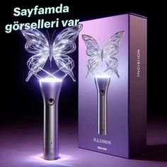 an electric toothbrush in the shape of a butterfly with its wings spread out, next to a box