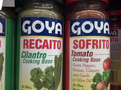 three jars of goya regatio sitting on a shelf in a grocery store