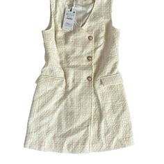 Super Cute. Chic A-line Sleeveless Dress With Buttons, Beige Button-up Dress For Winter, Beige Buttoned Winter Dresses, Beige Button-up Winter Dress, Winter Beige Button-up Dress, Chic Cream Buttoned Dress, Beige V-neck Mini Dress With Button Closure, Chic Cream Dress With Buttons, Beige Buttoned Mini Dress For Fall