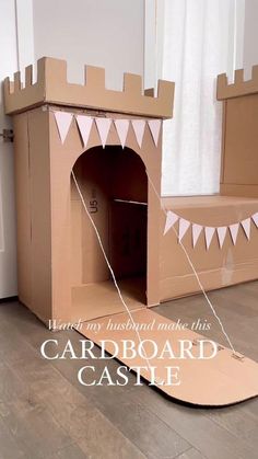 the cardboard castle is made to look like it has been built into the floor and walls