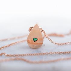 Fabulous, elegant and subtle 14k gold necklace with beautiful green emerald . The emerald gemstone is natural, Earth mined. It comes from Colombia. This emerald necklace is one of a kind. You are buying the necklace which is pictured. In the back of the gold necklace- tiny heart- symbol of LOVE This emeral necklace may be a perfect gift for her for birhtday, anniversary, Christmas, graduation or any other occasion. Central stone: *natural, pear shaped, Earth mined emerald - beautiful green color Formal Drop Emerald Necklace, Drop Emerald Necklaces For Formal Occasions, Emerald Drop Necklace For Formal Occasions, Elegant Green Round Charm Necklaces, Elegant Green Round Charm Necklace, Elegant Green Sterling Silver Charm Necklace, Heart Shaped Emerald Necklace As A Gift, Heart-shaped Emerald Necklaces As A Gift, Heart-shaped Emerald Necklace As A Gift