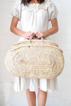 The chic beauty of the Oval Medina Bag speaks for itself. A total stunner on its own, the Medina straw bag is full of intricate handwoven detail and beautifully complements any look. Handmade in Morocco, this straw bag is a true artisan masterpiece and is a perfect functional bag for your everyday belongings. Does not include tassel. The Chic, Straw Bag, Morocco, Tassels, Straw, Hand Weaving, Beauty