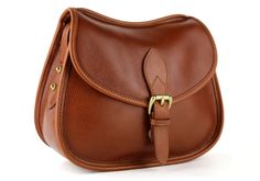 The Rider Shoulder Bag Classic Leather-lined Crossbody Saddle Bag, Classic Leather Lined Crossbody Saddle Bag, Classic Business Saddle Bag, Luxury Flap Saddle Bag For Daily Use, Classic Cognac Flap Bag With Leather Lining, Luxury Saddle Bag With Flap For Daily Use, Elegant Flap Saddle Bag With Detachable Strap, Classic Leather Lined Shoulder Saddle Bag, Classic Leather Lined Saddle Shoulder Bag