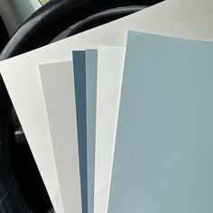 the interior of a car with several different colors of paper