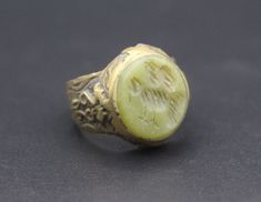 I am offering Vintage Afghan traditional alpaka handmade ring. Its %100 Hand Crafted workmanship with beautiful jade stones and unique bird carved with lovely designs. Please do not hesitate to contact if you have any questions.  Ring Size : 9 on US ring mandrel Weight : 9.0 Grams, Please know what you are bidding on. The metal of Most Kuchi, Afghan and Turkoman items are called with different names, Some called Alpaca silver, German Silver and Tibetan Silver. They do not give any allergies or b Handmade Green Brass Rings, Carved Jade Ring Jewelry, Spiritual Jade Rings As Gift, Traditional Handmade Green Rings, Carved Jade Rings As A Gift, Carved Jade Rings For A Gift, Untreated Jade Jewelry For Gift, Untreated Jade Jewelry Gift, Bohemian Carved Round Ring