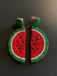 Fun 3" drop earrings hand-beaded in a watermelon slice design.  Post. A slice of summer that can be worn year-round, these hand-beaded earrings boast a bright red watermelon slice complete with green rind and black seeds.  Dangle length is 3" from post. 26-577 Fun Beaded Earrings For Summer Gifts, Fun Beaded Earrings For Beach In Summer, Fun Green Beaded Earrings For Summer, Green Beaded Earrings For Summer Fun, Red Beaded Jewelry For Summer, Summer Red Beaded Jewelry, Fun Beaded Earrings For Summer, Green Beaded Earrings For Summer, Casual Handmade Beaded Earrings For Summer