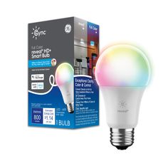 an energy saving light bulb in front of a box