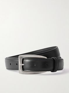 The Row's understated 'Arco' belt will work with everything from the label's chunky knitwear to slick tailoring or jeans. It's been made from supple black leather and has a silver buckle. Sleek Black Belts For Work, Designer Leather Belt, Black Leather Belt For Business Casual, Designer Fitted Leather Belt, Sleek Black Belt For Workwear, Timeless Black Belt For Workwear, Timeless Black Belt For Work, Timeless Black Belt Buckles For Workwear, Designer Fitted Black Belt