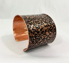 These unique, hand-formed copper and brass cuff bracelets with vibrant patinas create stunning accents to your personal style. Dress up or down- either way you'll be wearing an adornment that will turn heads, start conversations, and delight the eye of the beholder. This is a customizable cuff with a ball peen hammer texture. Ball Peen Hammers leave a round, polkadot type mark on the metal. This bracelet is offered in an antique/darkening patina to give the most contrast between hammer marks and Unique Hammered Copper Cuff Bracelet, Handmade Bronze Cuff Bracelet, Hand Forged Bronze Copper Cuff Bracelet, Handmade Copper Cuff Bracelet, Artisan Bronze Copper Cuff Bracelet, Unique Bronze Copper Cuff Bracelet, Brass Cuff Bracelet, Eye Of The Beholder, Copper Cuff Bracelet