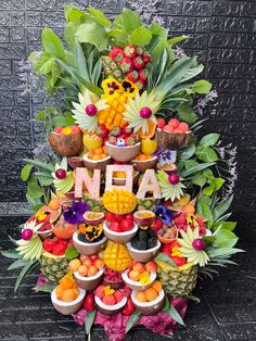 a large display of fruits and vegetables on top of each other