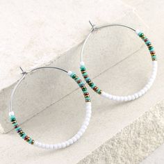 Seed bead hoop earrings in white and turquoise. * DETAILS:    ‣ Japanese glass seed beads     ‣ colors: matte white and turquoise + shiny, metallic green, bronze, red bronze and hematite    ‣ carefully handmade, polished earring hoops, made of 316L stainless steel * SIZE (choose from the drop-down menu):    ‣ SMALL:    approx Ø: 1.3" / 3.4 cm   ‣ LARGE:   approx Ø: 1.65" / 4.2 cm   size of the beads: 2 mm Very lightweight earrings, comfortable to wear. Click here for more beaded hoop earrings: w Bohemian White Hoop Earrings For Beach, White Circular Jewelry For Jewelry Making, White Circular Jewelry For The Beach, White Bohemian Beaded Earrings Nickel Free, White Small Hoop Earrings For Beach, White Bohemian Dangle Hoop Earrings, Adjustable Nickel-free White Hoop Earrings, Adjustable White Nickel Free Hoop Earrings, White Bohemian Hoop Earrings