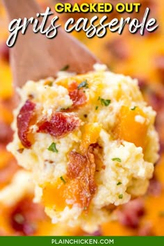 a spoon full of baked grits casserole with bacon and cheese on it