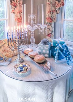 a table topped with donuts and candles