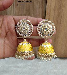 Dark Gold jhumka earrings set. Earrings length: 2.9 inches (with drops) Stud diameter- 1.2 inches Dome Size: 1.1 inches Festive Yellow Meenakari Jhumkas, Yellow Kundan Chandbali Earrings, Yellow Chandbali Earrings For Diwali, Yellow Chandbali Jhumkas For Wedding, Traditional Yellow Earrings With Latkans, Yellow Meenakari Earrings For Diwali, Festive Yellow Chandbali Earrings, Yellow Meenakari Earrings For Festive Season, Yellow Meenakari Chandbali Earrings