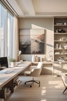 an office with a desk, chair and bookcase in front of large windows overlooking the ocean