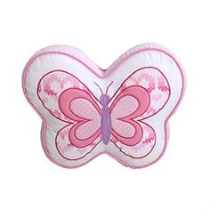 a pink and white butterfly shaped pillow