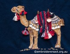 a camel made out of fabric on a blue background