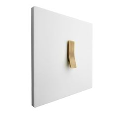 a close up of a white wall with a wooden handle on the back of it