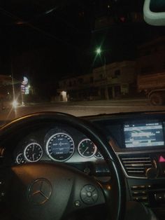 the dashboard of a car at night time