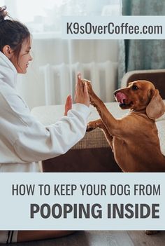 a woman in white coat petting a brown dog