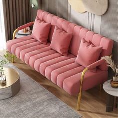 a living room with a pink couch and rug