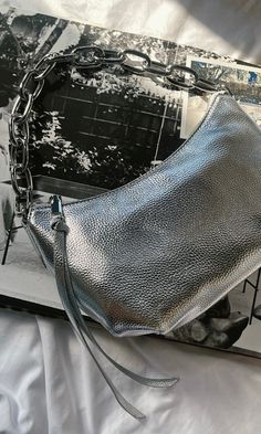 FINAL SALE, NO RETURNS This silver shoulder bag is THE moment. Obsessing over the silver chain strap on the metallic bag! A must-have for NYE! Silver Shoulder Bag, Silver Bags, Metallic Bag, Chain Strap, Tank Shirt, Tank Top Shirt, Final Sale, Silver Chain, Multi Color