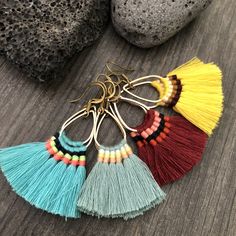 Fun light and easy to wear tassel earrings. Made with a teardrop brass base and unique mix of colorful tassels. You can choose from 4 different pairs that are in different colors. 4 unique pairs that will rock your day by day outfits. You can choose between the bright blue, light blue, yellow and burgundy. The earrings are 4.6cm- 1.90 inch long 3.6cm- 1.5 inch wide (where the tassels are) They have a drop length of 5.5cm- 2.25 inch A most have addition to your jewelry collection, To see more uni Tassel Drop Earrings For Beach, Bohemian Tassel Drop Earrings With Fringe, Bohemian Fringe Tassel Drop Earrings, Trendy Tassel Earrings For Festival, Yellow And Burgundy, Colorful Tassels, Royal Blue Earrings, Burgundy Earrings, Artsy Earrings